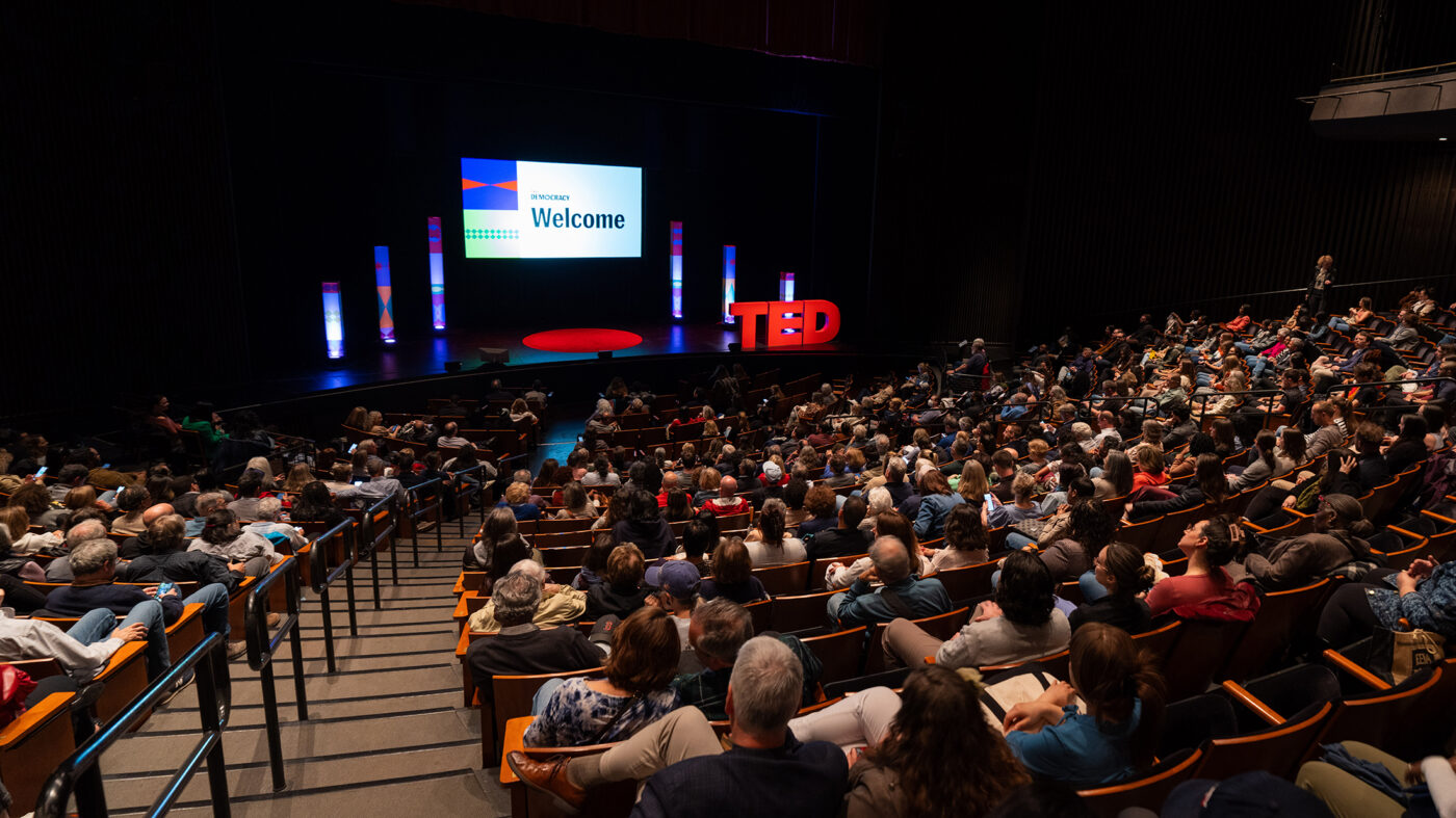 Photo of a TED event and audience