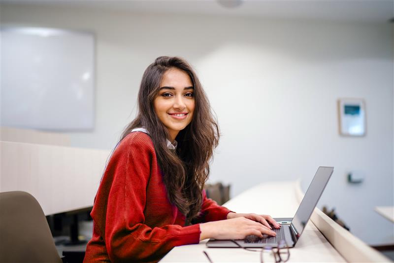 Female Student Using a Laptop Computer